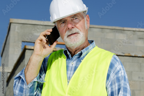 engineer gesticulates on the cellphone