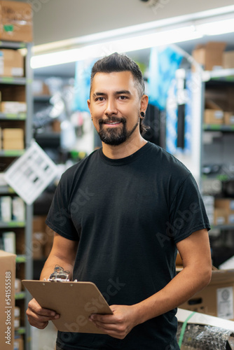 merchandiser checking products availibility for car repair
