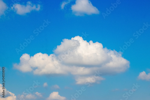 Fototapeta Naklejka Na Ścianę i Meble -  A big white fluffy cloud in the blue sky