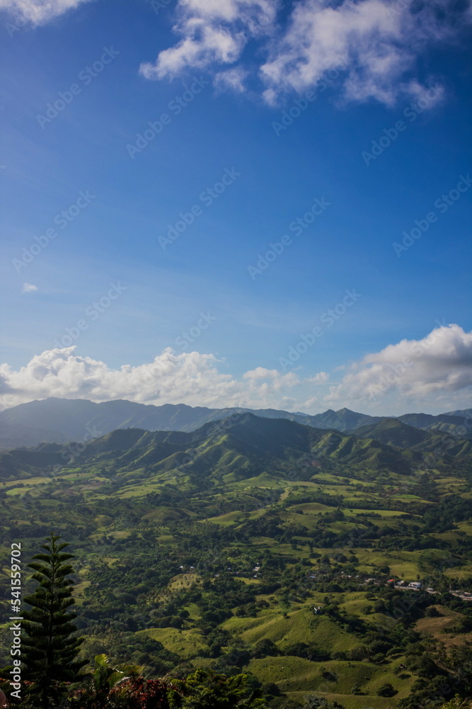 Green mountains and valleys of the island of Haiti. Blue mountai