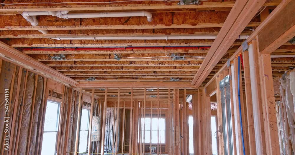 Under construction new building structure beams home wood framing on construction site for new residential unit