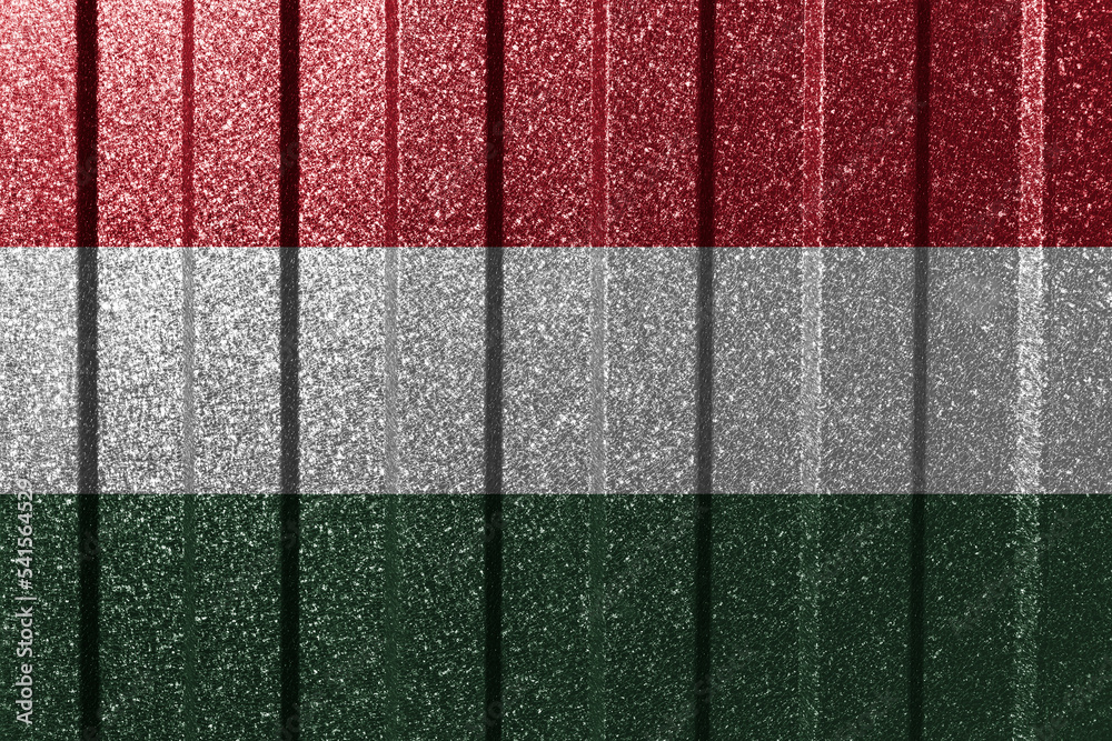 Textured flag of Hungary on metal wall. Colorful natural abstract geometric background with lines. Textured flag of Hungary on metal wall. Colorful natural abstract geometric background with lines.
