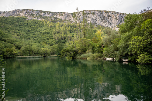 Beautiful rocky cliffs and mountain peaks, covered with dense forest near the town of Omis, Croatia in the Cetina river canyon