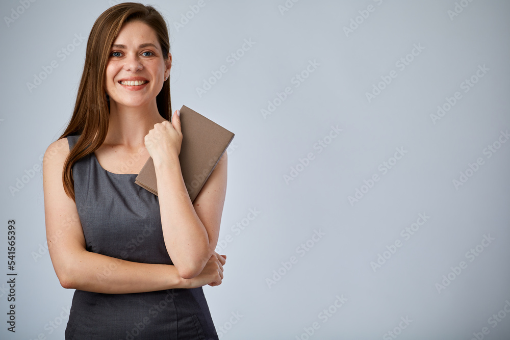 Smiling secretary holding book or workbook. Isolated advertising portrait. Smiling secretary holding book or workbook. Isolated advertising portrait.