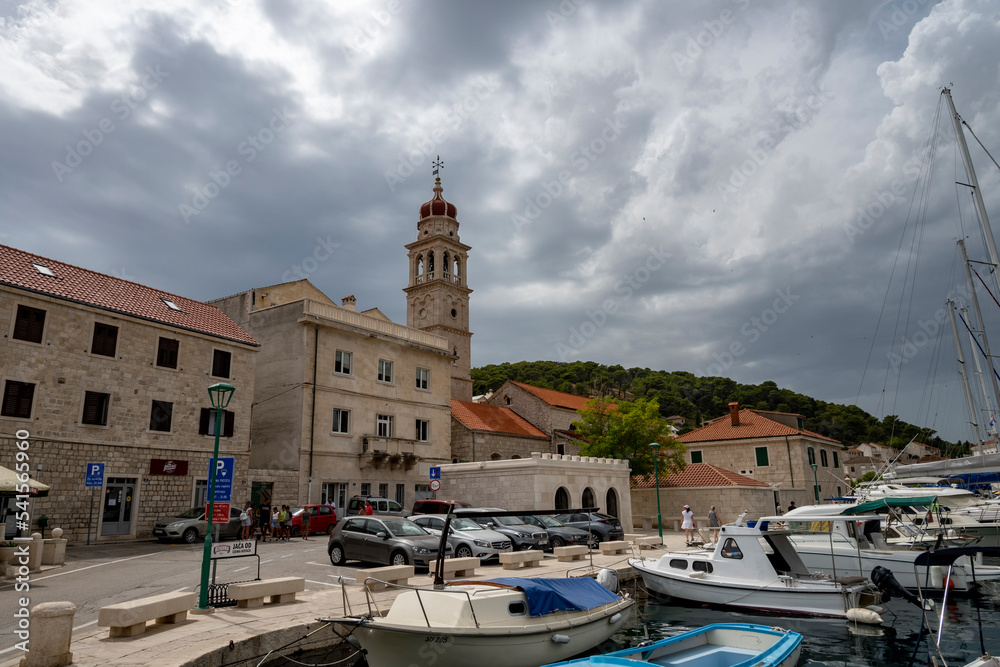 Beautiful stone houses and church in the famous town of Pucisca on Brac island, where famous stone masons school is founded