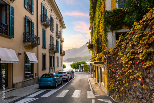 Fototapeta Naklejka Na Ścianę i Meble -  One of the main roads leading to the picturesque village of Bellagio, Italy, with the lake and mountains in view at sunset on Lake Como.