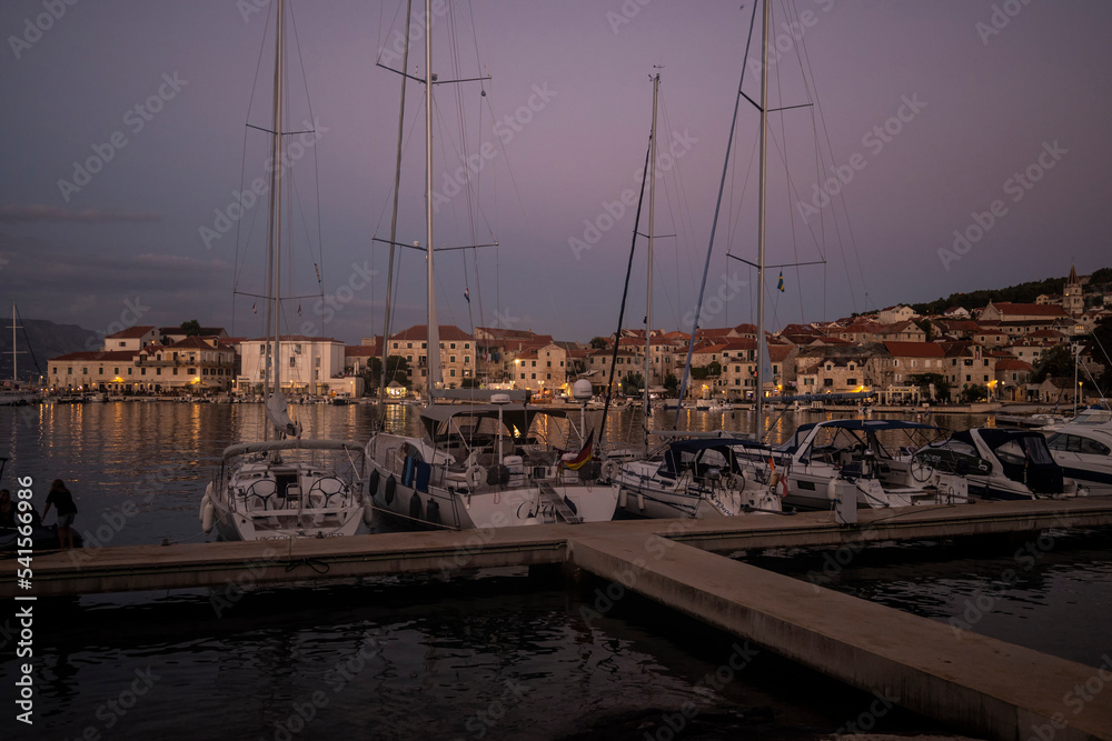 Sailing boats anchored in the town of Postira on Brac island, Croatia for the night