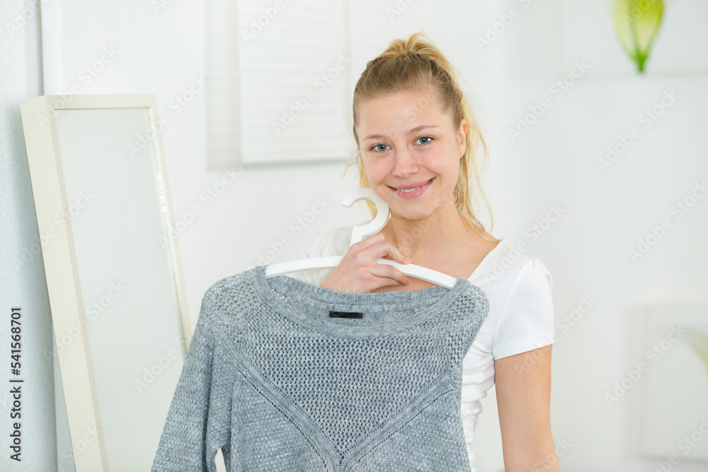 woman trying on clothes at shop woman trying on clothes at shop