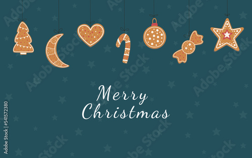 Merry christmas banner with ginger cookies on dark blue background - new years tree, moon, heart, star, christmas candies