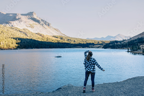 Woman hiker enjoying view of the beautiful lake
