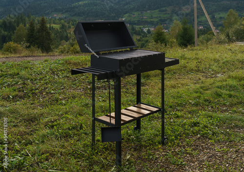 Modern barbeque grill outdoor with mountain view