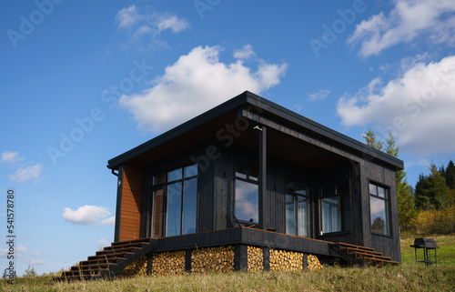 exterior of a black modern wooden cabin