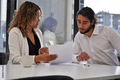 Business coaching session with two pacific islanders in office