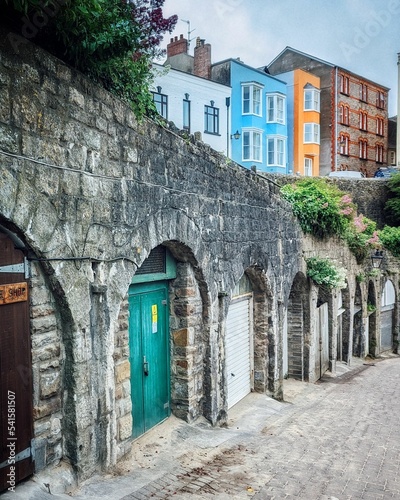 Photography Vertical shot of cobblestone alley colorful buildings in background Penniless Co