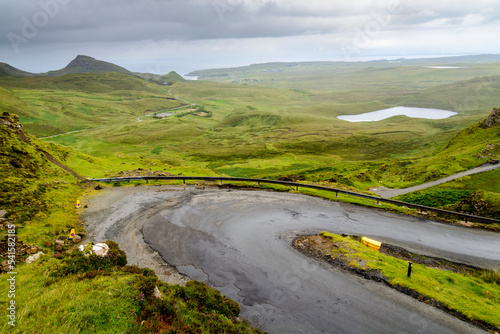 Winding narrow road,heading down the Quraing mountain sides,Totternish,Isle of Skye,Highlands of Scotland,UK. photo