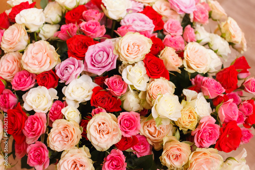 A bouquet of roses. A big bouquet of flowers. Multicolored roses. Delicate wedding bouquet.