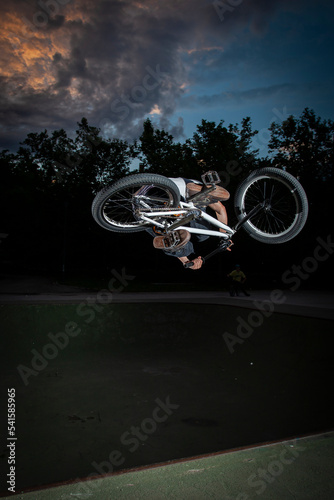 boy with his BMX bike at a skatepark photo