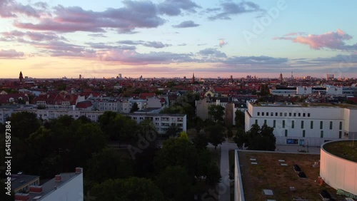 Pink clouds golden hour sunset. Calm aerial view flight berlin photo