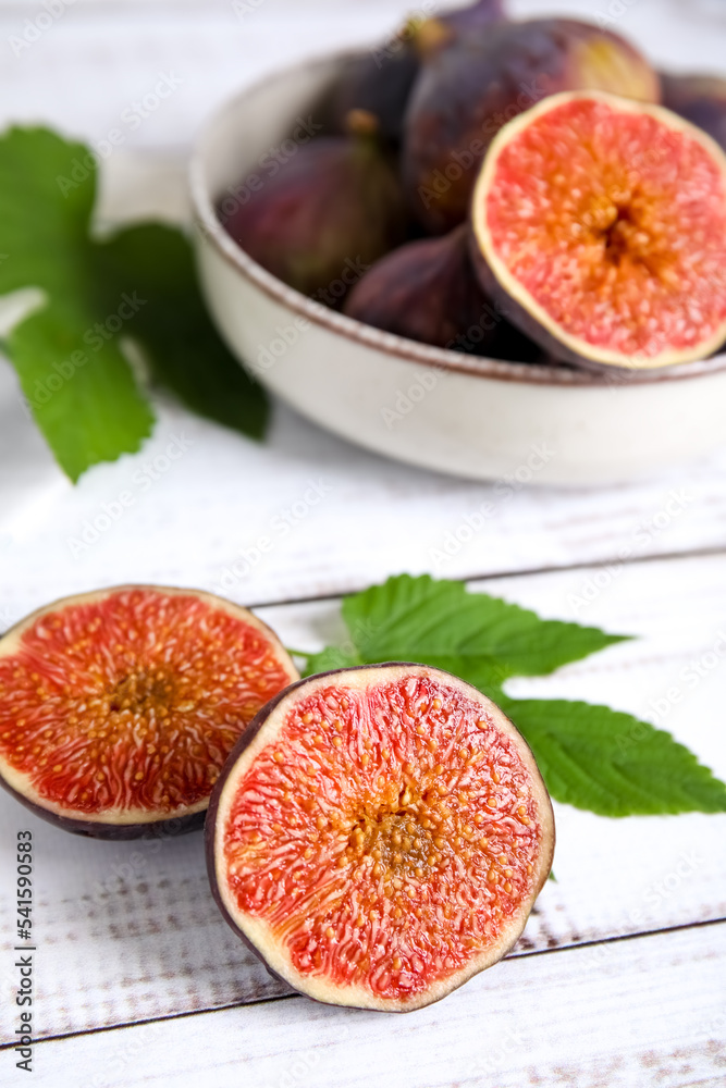 Fresh ripe figs on white wooden table Fresh ripe figs on white wooden table