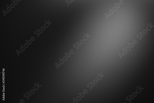Dark black and gray blurred  gradient background has a little abstract light.