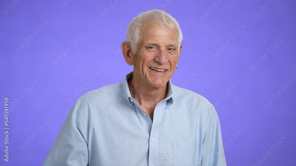 Portrait of a senior old man with gray hair smiling at the camera. Happy elderly man smiling. Grandpa is happy to live, a healthy lifestyle. Close-up Portrait of a senior old man with gray hair smiling at the camera. Happy elderly man smiling. Grandpa is happy to live, a healthy lifestyle. Close-up