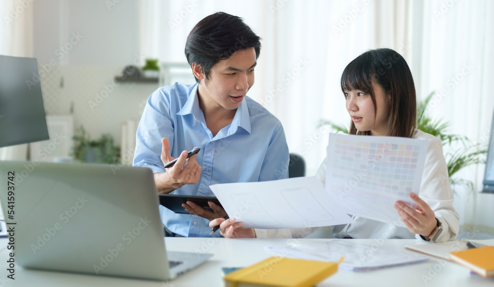 Handsome asian man employee sharing her strategy with her colleagues.. Handsome asian man employee sharing her strategy with her colleagues..