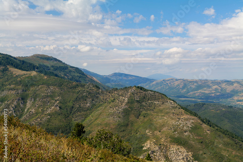 Summer mountain landscape in the USA. Sunny day and cloudy sky, hills view. High-quality photo