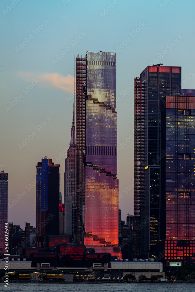 View to Manhattan skyline Hudson Yards skyscrapers, from Weehawken Waterfront in Hudson River at sunset. High quality photo