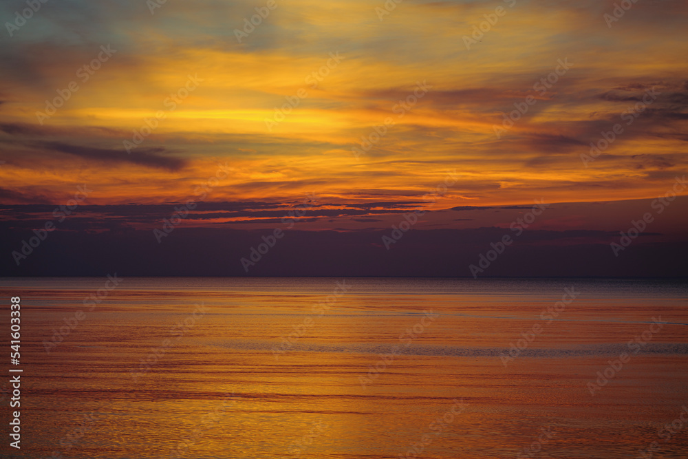 Panoramic view of seascape sunset with lingering rays of the sun at the Atlantic Ocean in Woodland State Park, Long Island the USA. High-quality photo