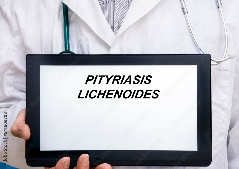 Pityriasis Lichenoides.  Doctor with rare or orphan disease text on tablet screen Pityriasis Lichenoides