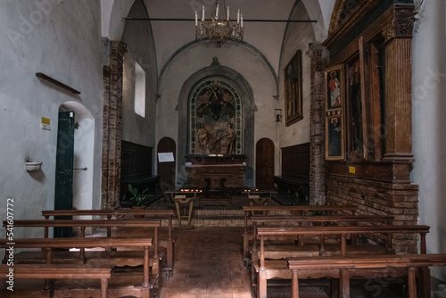 Interior of a simple medieval church with white walls