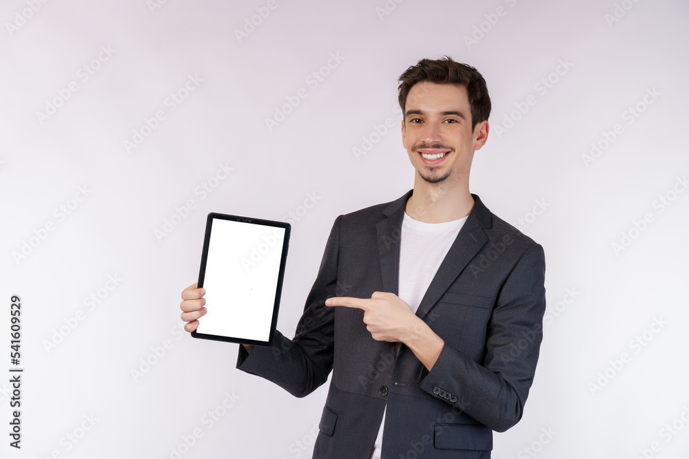 Portrait of attractive cheerful businessman using device app searching web isolated over white color background Portrait of attractive cheerful businessman using device app searching web isolated over white color background