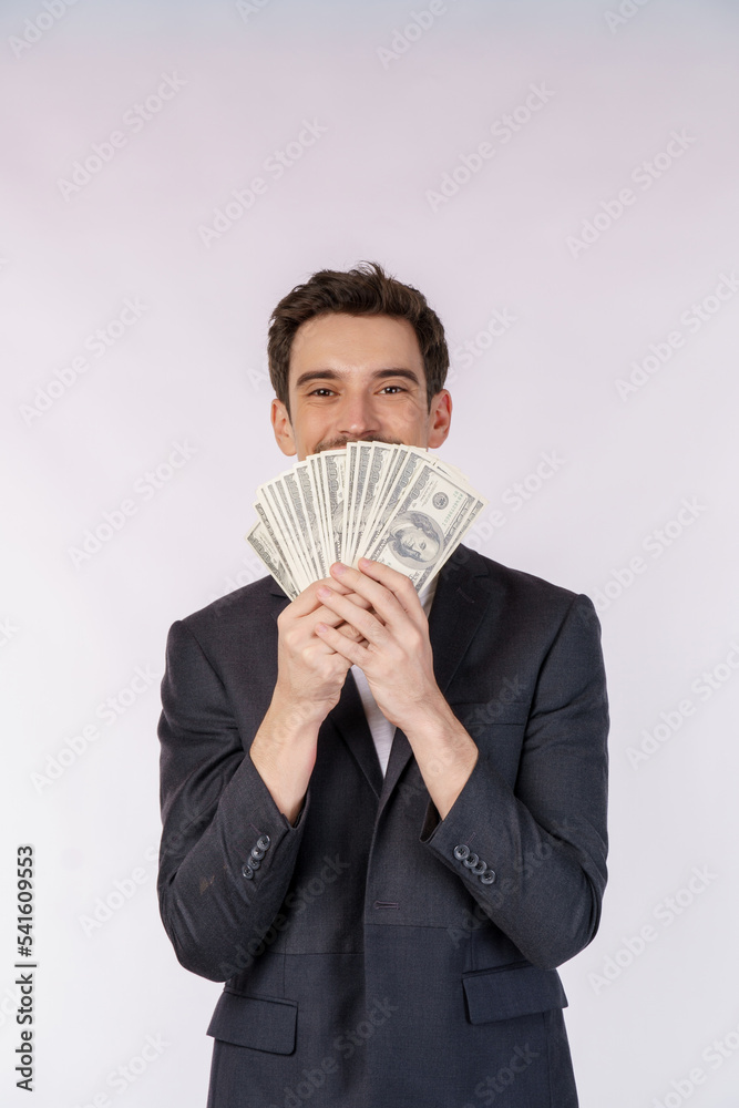 Portrait of a cheerful man holding dollar bills over white background Portrait of a cheerful man holding dollar bills over white background