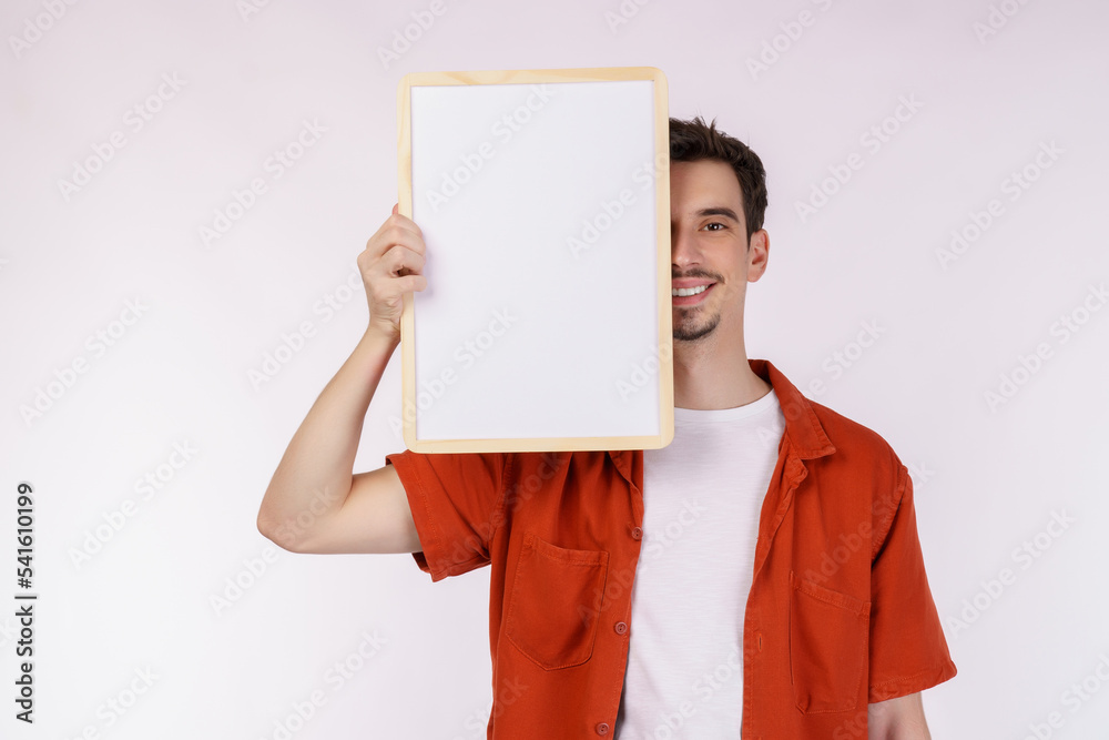 Portrait of happy man showing blank signboard on isolated white background Portrait of happy man showing blank signboard on isolated white background