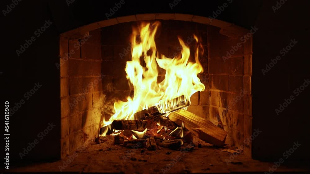 Warm Cozy Fireplace with Real Wood Burning in it. Cozy Winter Concept. Slow Motion. A Looping Clip of a Fireplace with Medium Size Flames. UHD TV screen saver. Video for meditation Warm Cozy Fireplace with Real Wood Burning in it. Cozy Winter Concept. Slow Motion. A Looping Clip of a Fireplace with Medium Size Flames. UHD TV screen saver. Video for meditation