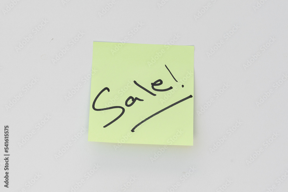 Sale word hand written on a yellow sticky note isolated on white background Sale word hand written on a yellow sticky note isolated on white background