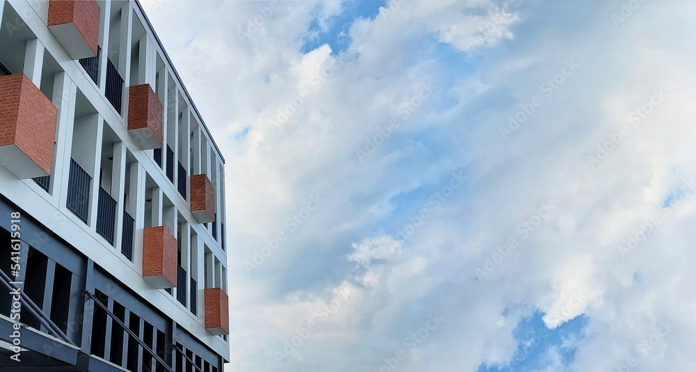 new reinforced concrete home with blue sky white clouds shape natural background , copy space new reinforced concrete home with blue sky white clouds shape natural background , copy space