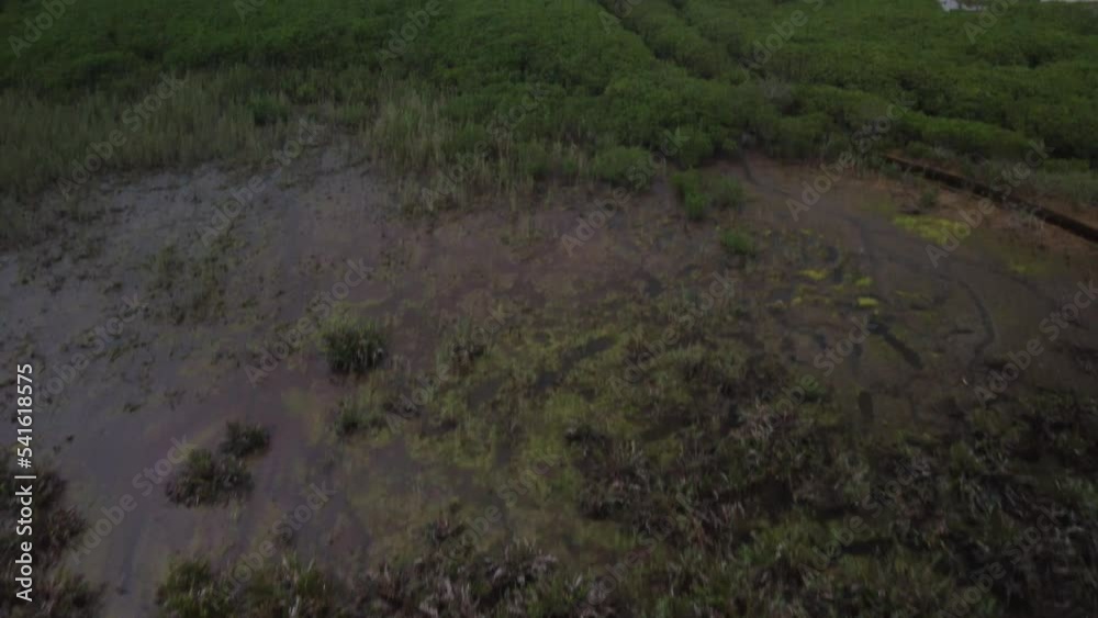 Drone Shot Over Some Fields with a City in the Distance