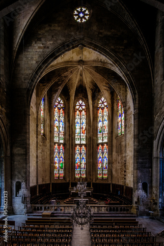 Interior  cross ribbed vault and stained glass of the gothic Saint Etienne collegiate church of Capestang  in the South of France  Herault 