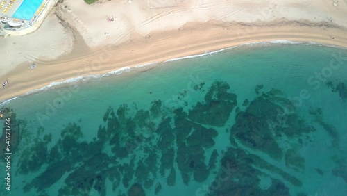 Aerial shot of an impressive beach with transparent water on the Costa Brava in Girona Playa de Aro and S'Agaró photo