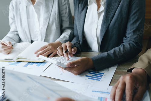 Asian entrepreneurs and business people meeting in a conference room in business planning, financial budget and investment risk assessment to analyze customer groups to increase company growth