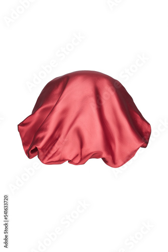Close-up shot of a red sleep cap with a wide elastic band. A satin hair bonnet for protecting hair at night is isolated on a white background. Back view.