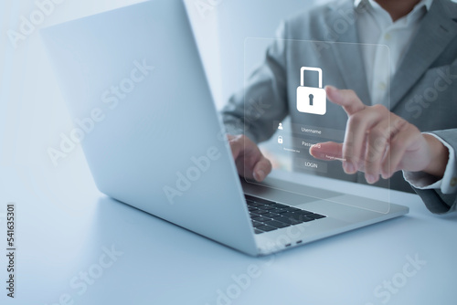 Cybersecurity and data privacy protection concept. And Internet network security technology. Businessman using computer and virtual screen login acoount. photo