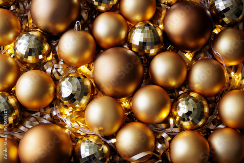 christmas and new year background - golden Christmas balls and led lights
