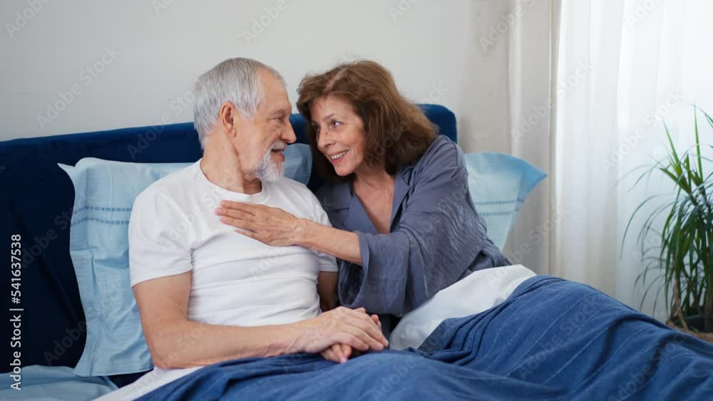 Senior couple happy together in bed. Senior couple happy together in bed.
