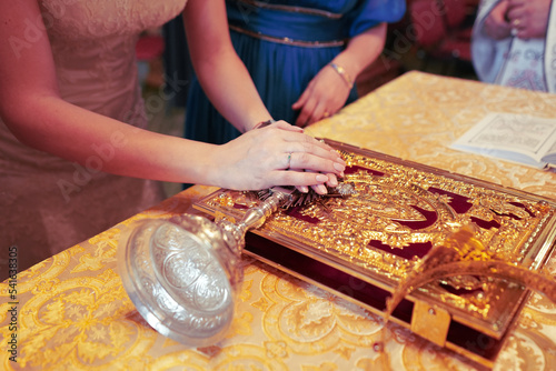person holding hands on the
church book for  wedding
