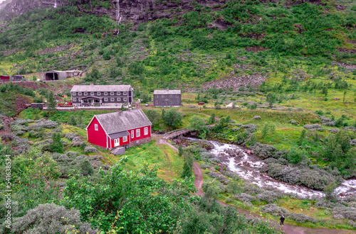 Colorful wooden cottages in Myrdal, next to Flåmselvi (or Moldåni) river, near the railway station. Myrdal is an area with some cottages and hotels, in Aurland, Vestland County. photo