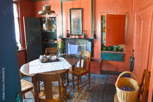 Enkhuizen, the Netherlands, August 7, 2022: The simple interior of a fisherman s cottage at the Zuiderzee Museum in Enkhuizen photo
