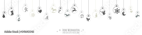 Foto hanging baubles with christmas icons and greetings