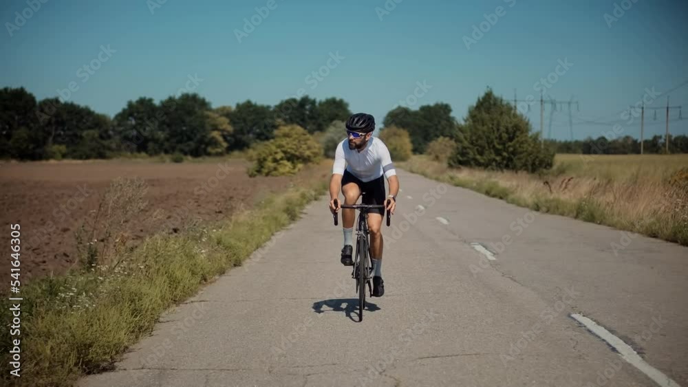 Sport Recreation Bike Cycling On Sunset Time. Cyclist In Helmet Riding On Sunset.Triathlon Time Trial Bicycle.Triathlete Training Endurance Cycling Race.Fit Cyclist Cardio Workout On Triathlon Bike Sport Recreation Bike Cycling On Sunset Time. Cyclist In Helmet Riding On Sunset.Triathlon Time Trial Bicycle.Triathlete Training Endurance Cycling Race.Fit Cyclist Cardio Workout On Triathlon Bike